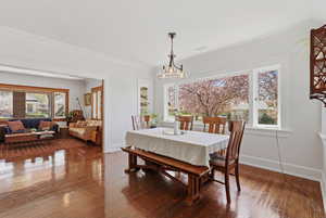 Open concept dining room with hardwood floors