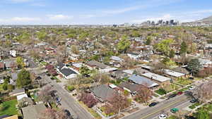 Aerial view of property and surrounding area with skyline and nearby suburban area