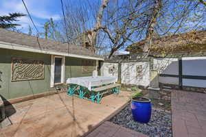 View of patio / terrace featuring outdoor dining area and an outdoor structure