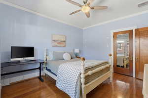 Main floor bedroom with wood floors