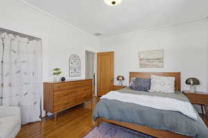 Upstairs bedroom with wood floors