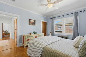 Main floor bedroom with wood floors