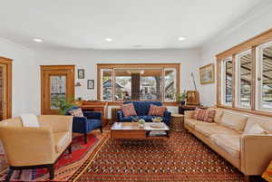 Main floor living room with hardwood floors and trim