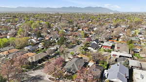 Aerial overview of property's location featuring nearby suburban area and mountains