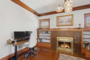 Den with hardwood built ins and fireplace