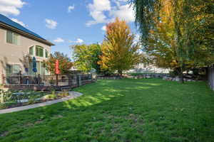 View of yard with a wooden deck