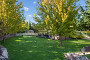 Fenced backyard featuring a wooden deck