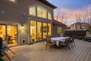 Deck at dusk with outdoor dining area