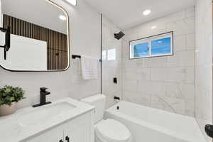 Full bath featuring vanity, shower / washtub combination, and recessed lighting