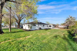 Back of property with stucco siding and a patio area