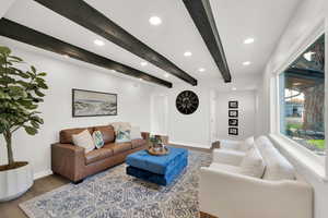 Living area featuring recessed lighting, beamed ceiling, and wood finished floors
