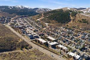 View of property location featuring a mountainous background and nearby suburban area
