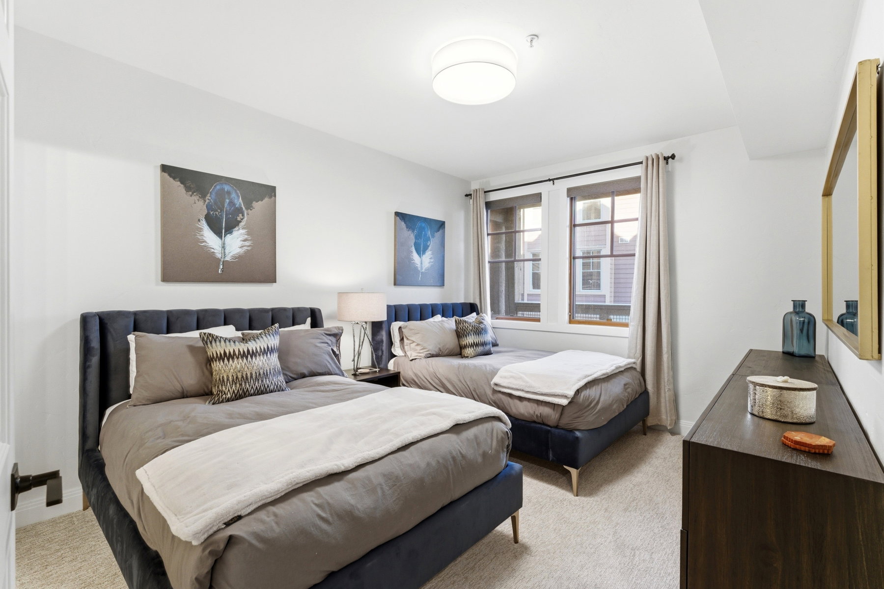 Bedroom featuring light carpet