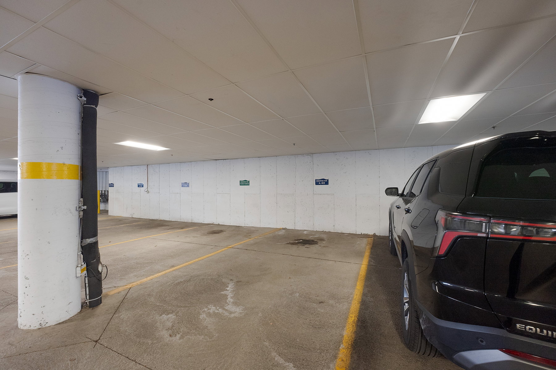 Garage featuring a parking deck