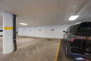 Garage featuring a parking deck