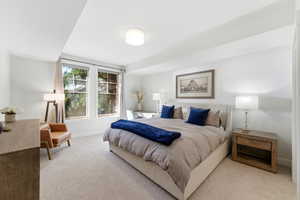 Bedroom featuring carpet and baseboards