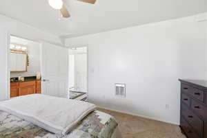 Bedroom with light carpet and a ceiling fan