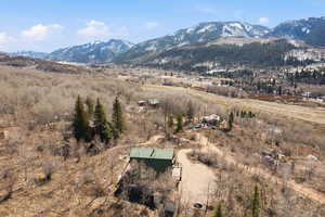 View of mountain backdrop with rural landscape