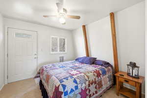 Bedroom featuring light colored carpet and ceiling fan