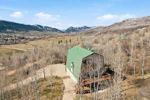 Overview of rural landscape featuring a mountain backdrop