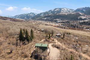 View of mountain background featuring rural landscape
