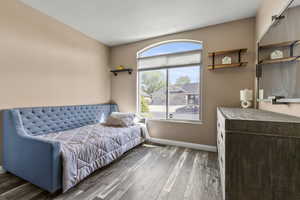 Sitting room featuring light wood-style floors and baseboards
