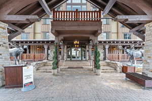 Entrance to property with french doors and stone siding