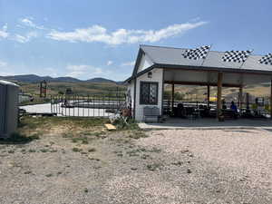 View of yard with a patio and a mountain view