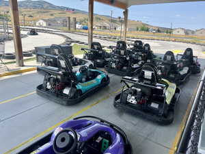 View of parking featuring a residential view and a mountain view