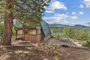 View of outbuilding featuring a mountain view