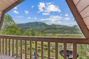 View of mountain backdrop with a forest