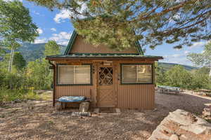 View of outbuilding featuring a mountain view