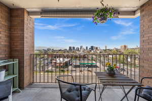 Balcony featuring a western view of downtown Salt Lake City