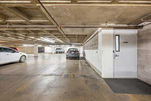 Garage with reserved parking spot #15 right next to door to elevators