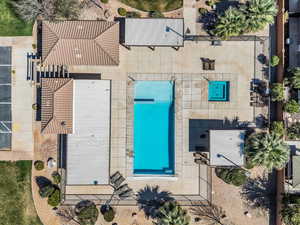 Aerial view of property and surrounding area with a pool
