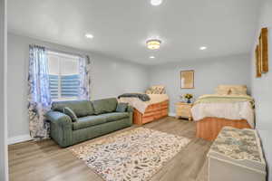 Bedroom featuring light wood-type flooring and recessed lighting