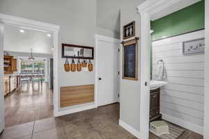 Corridor featuring light tile patterned floors and recessed lighting