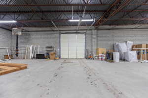 Garage featuring a heating unit