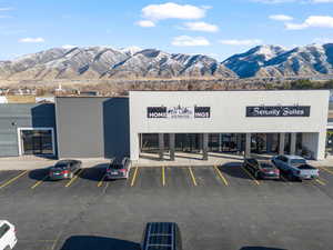 Uncovered parking lot featuring a mountain view