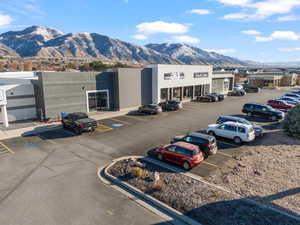 Uncovered parking lot featuring a mountain view