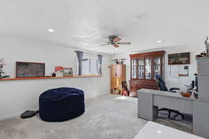 Office area featuring light colored carpet, ceiling fan, recessed lighting, and a textured ceiling