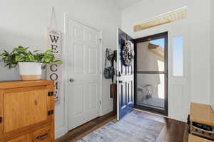 Entrance foyer with dark wood-type flooring