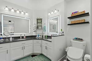 Full bathroom featuring vanity and toilet