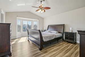 Bedroom featuring light wood finished floors and ceiling fan
