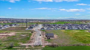 Aerial view of residential area featuring a mountain backdrop