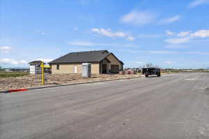 View of asphalt street featuring curbs
