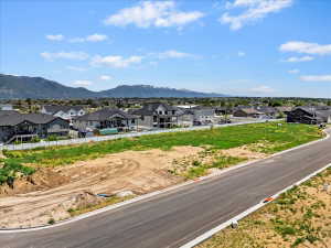 Aerial view of residential area featuring a mountain backdrop