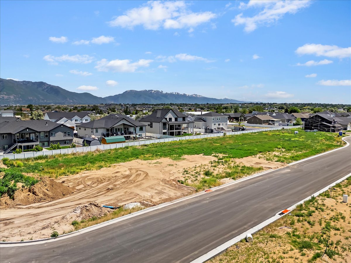Aerial view of residential area featuring a mountain backdrop