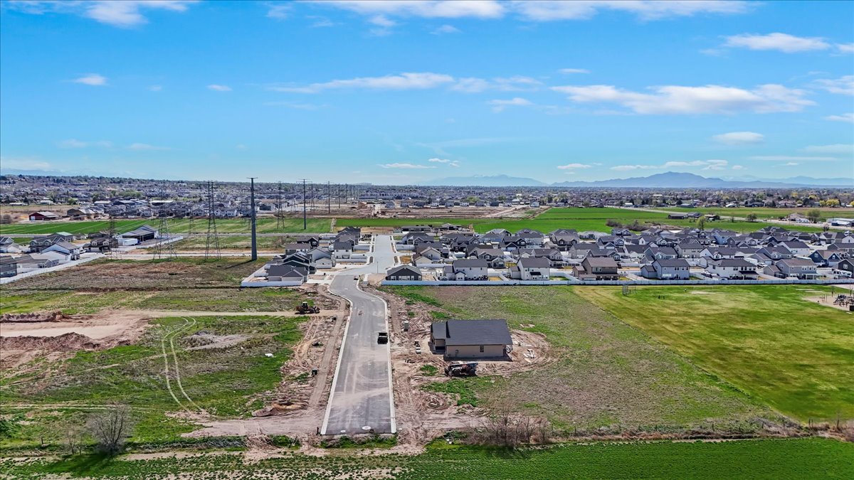 Aerial view of residential area featuring a mountain backdrop