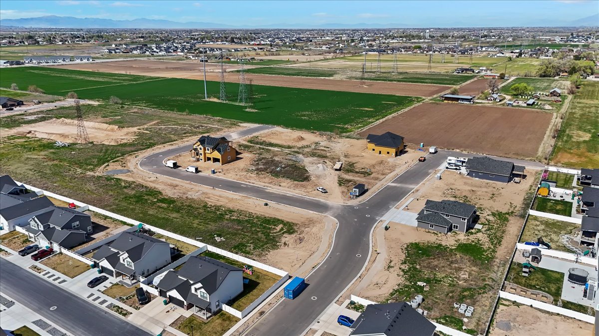 Aerial overview of property's location featuring nearby suburban area